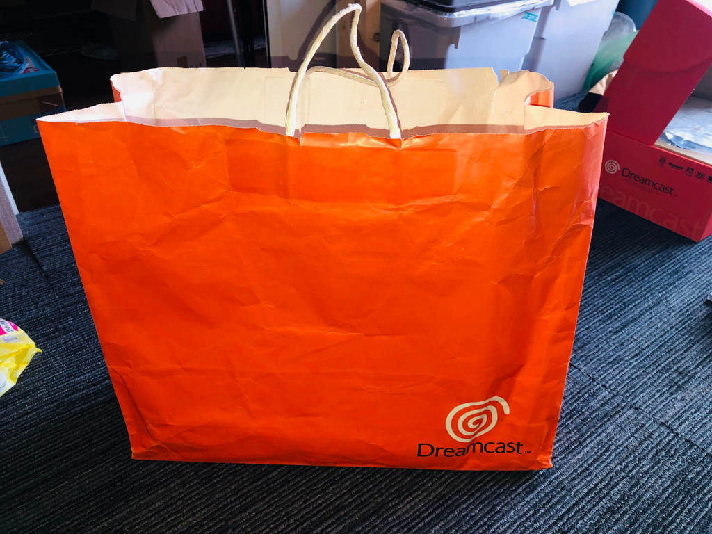 Sega Dreamcast orange shopping bag 1998 launch promotional paper promo logo