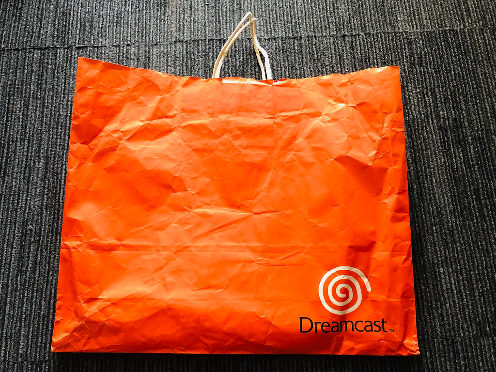 Sega Dreamcast orange shopping bag 1998 launch promotional paper promo logo