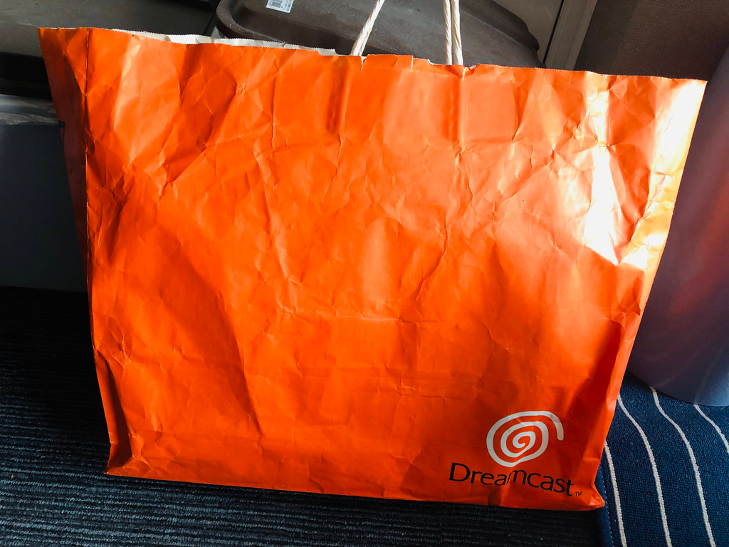 Sega Dreamcast orange shopping bag 1998 launch promotional paper promo logo
