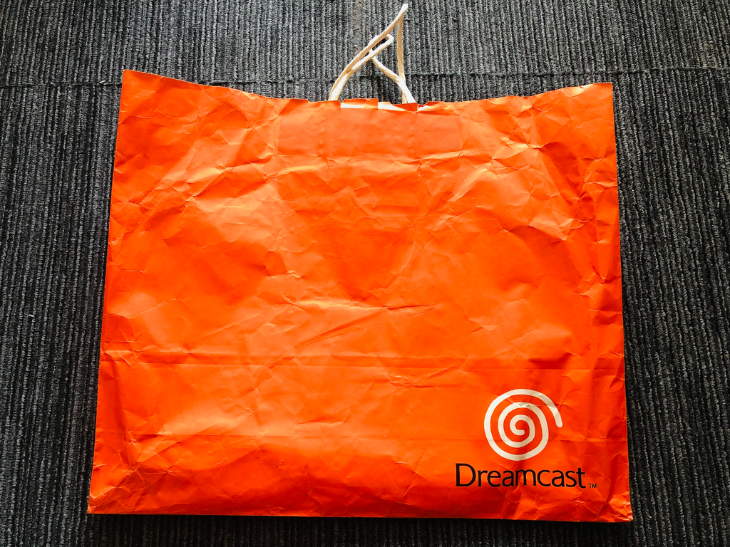 Sega Dreamcast orange shopping bag 1998 launch promotional paper promo logo