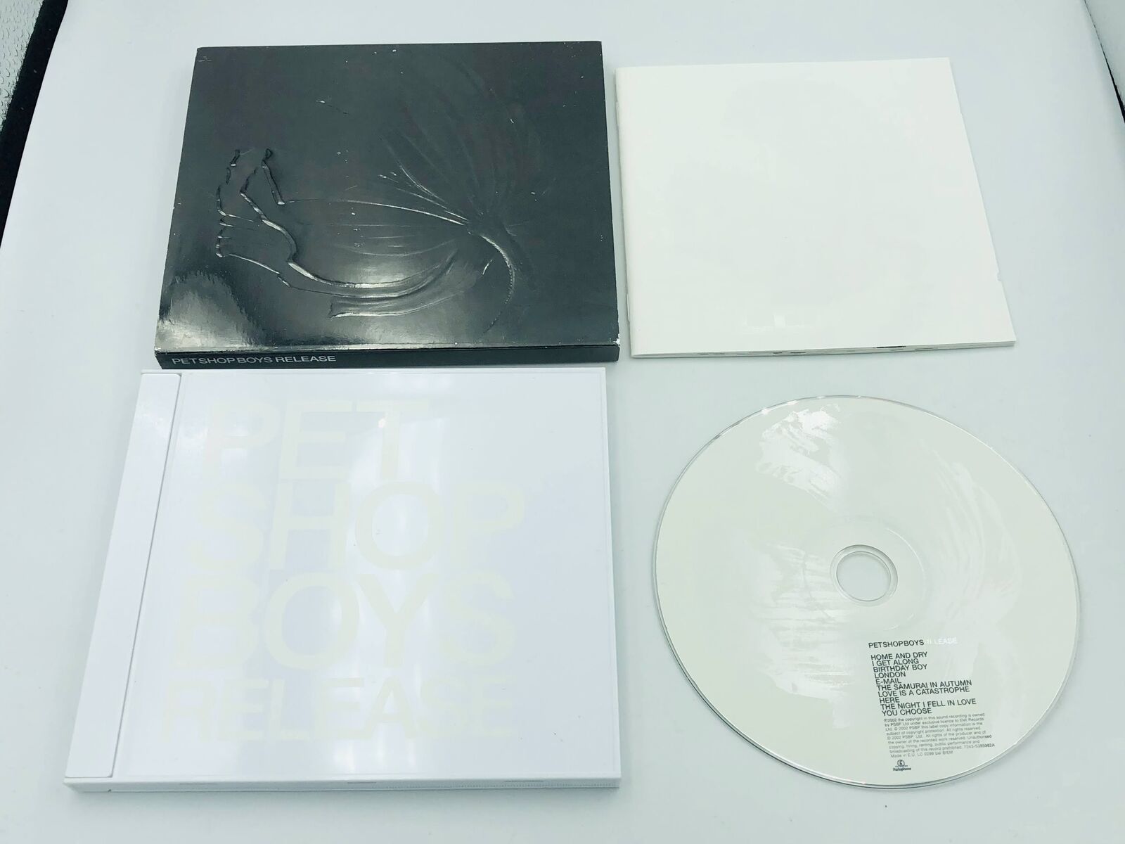 Pet Shop Boys Release 2002 CD with poppy slipcase slipcover, opaque white case